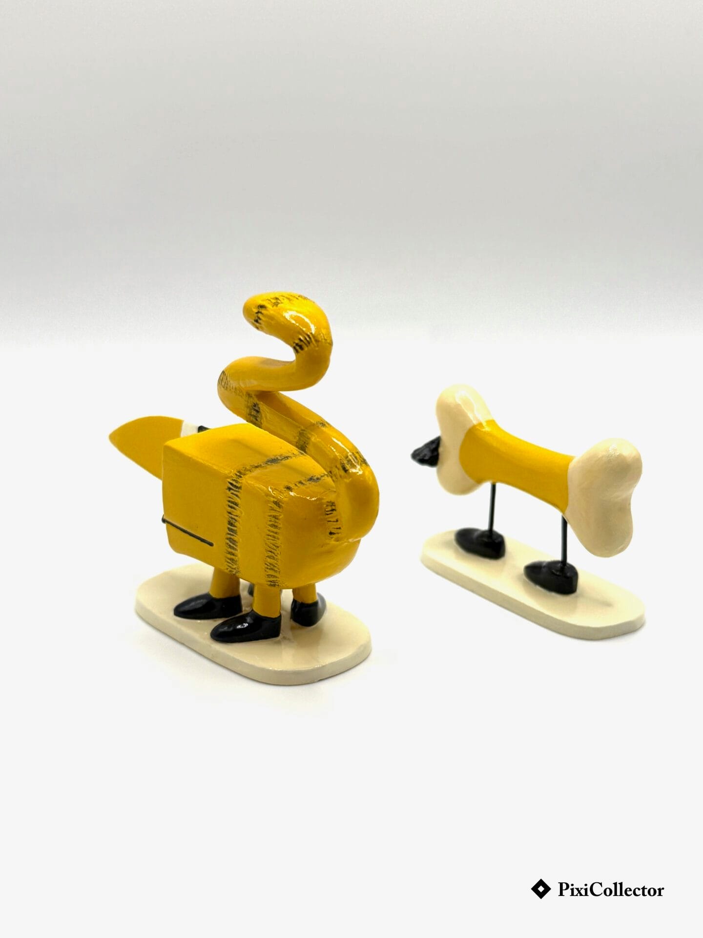 Le Minetcanthrope et son squelette - PixiCollector.com Pixi figurine Shadoks en métal Le Minetcanthrope et son squelette (réf. 82333) – vue de dos